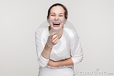 Blame you, or shame you. Girl pointing at camera and smiling Stock Photo