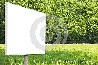 Blank advertising signboard in a countryside with forest in the background - concept with space for inserting text Stock Photo