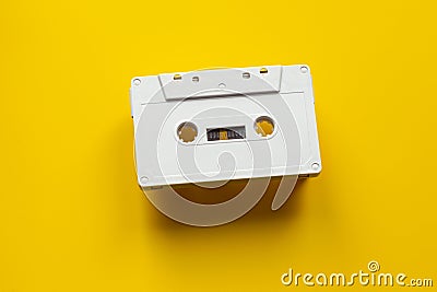 Blank audio cassette on a yellow background Stock Photo