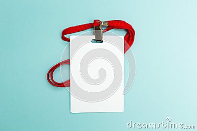 Blank badge mockup isolated on blue background. Plain empty name tag mock up with red string Stock Photo