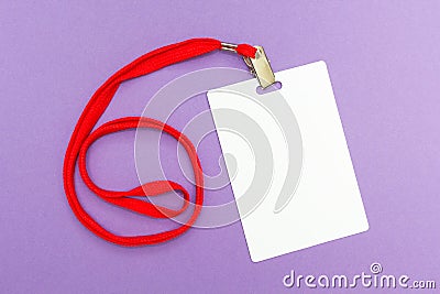 Blank badge mockup on purple background. Plain empty name tag with red string Stock Photo
