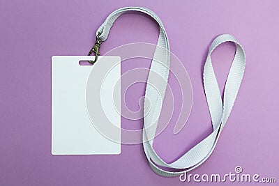 Blank badge mockup isolated on purple. Plain empty name tag with string Stock Photo