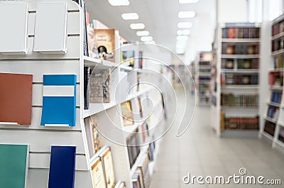 Blank bestsellers on shelf in book shop store with blurred back plane Stock Photo