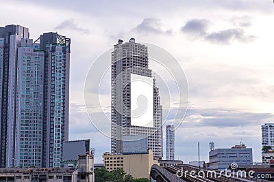 Blank billboard or advertising poster on the building wall mock up, for advertisement concept background Stock Photo