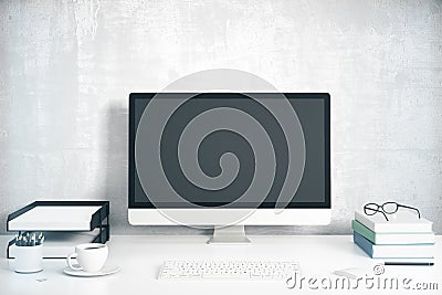 Blank black computer screen with office accessories on white tab Stock Photo