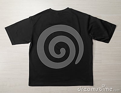 Blank Black Oversized T-shirt mockup template on the floor. Stock Photo