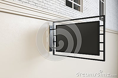 Blank black rectangualar business outdoor signage with black iron frame on light wall. Mockup Stock Photo