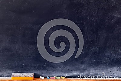 Blank blackboard with colored chalks Stock Photo