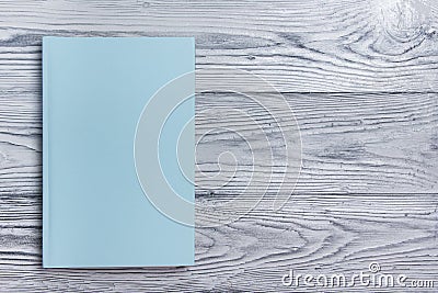 Blank book cover on textured wood background. Copy space Stock Photo