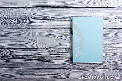 Blank book cover on textured wood background. Copy space Stock Photo