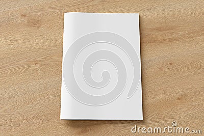 Blank brochure or booklet cover mock up on wooden background. Isolated with clipping path around brochure. Front view. Stock Photo