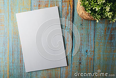 Blank A4 brochure mockup on blue wooden background Stock Photo