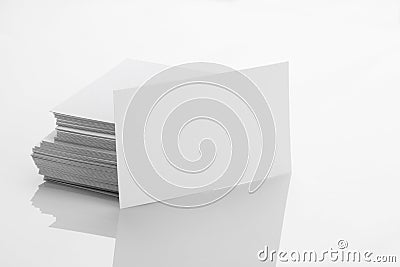 Blank Business Card Mockup on White Reflective Background Stock Photo