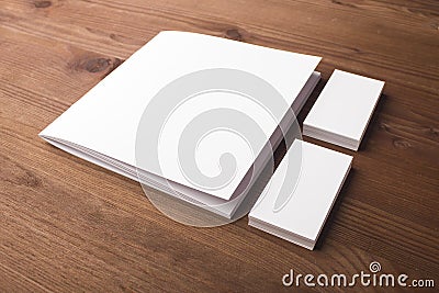 Blank business cards and booklet, brochure on a wooden background. Stock Photo