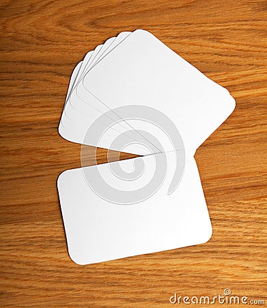 Blank business cards with rounded corners on a wooden background Stock Photo