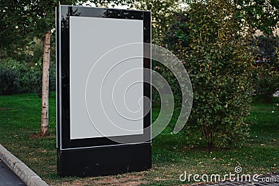 Blank canvas banner stand at park. Empty billboard advertising. Stock Photo