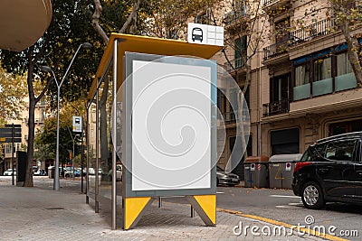 Blank canvas white outdoor banner at bus stop next to facade of ancient building at european town. Stock Photo