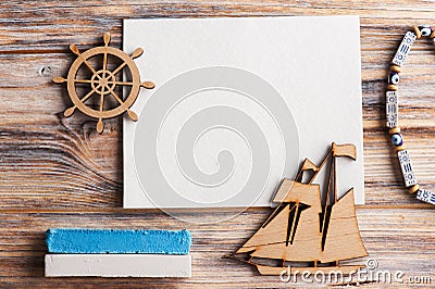 Blank card, wooden boat and steering wheel Stock Photo