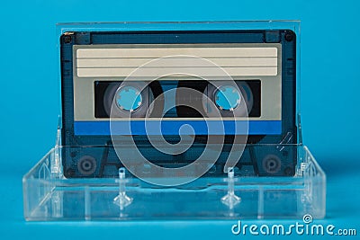 Blank cassette tape box with retro cassette on blue background Stock Photo