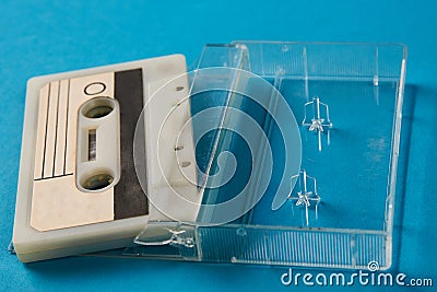 Blank cassette tape box with retro cassette on blue background Stock Photo
