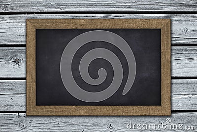 Blank chalkboard on wooden wall background Stock Photo