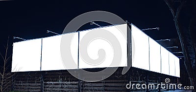 Blank citylight for advertising on the building at city night, copyspace for your text, image, design, flyer Stock Photo