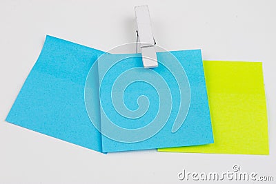 Blank colored sticky notes with clips. Office accessories for listing and memorizing on the table. Stock Photo