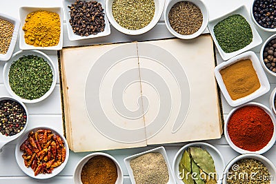 Blank cookbook and various spices. Stock Photo