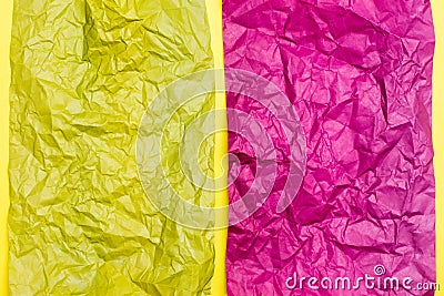 Blank crumpled purple and yellow sheets of colored paper on a yellow cardboard background. Textural motley background Stock Photo