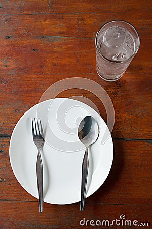Blank dish, spoon and fork Stock Photo
