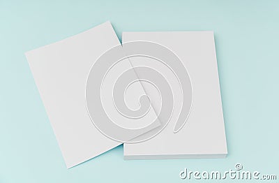 Blank flyer poster, brochure mockup,A4, US-Letter, on blue background . Stock Photo