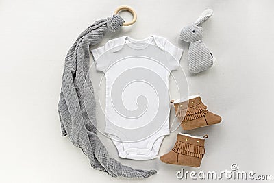 Blank gender neutral white baby bodysuit mockup with accessories Stock Photo