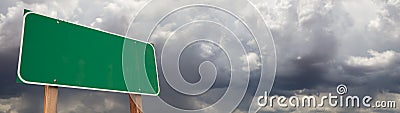 Blank Green Road Sign Against Ominous Cloudy Stormy Sky Background Banner Stock Photo