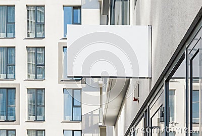 Blank hanging outdoor business wall sign Stock Photo