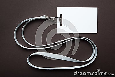 Blank ID card, Identification white id card with copy space, isolated on brown. Mockup Stock Photo