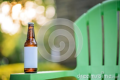 Blank Label Beer Bottle on Green Lawn Chair Stock Photo