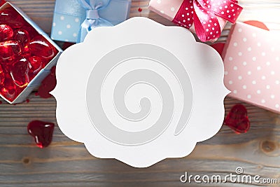 Blank label and gift boxes on wooden background Stock Photo