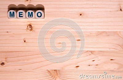 Blank light colored wood fills this template image with the word Memo spelled out in blocks along the top Stock Photo