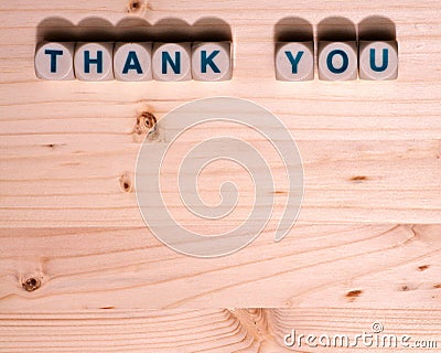 Blank light colored wood fills this template image with the words Thank You spelled out in blocks along the top Stock Photo