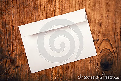 Blank mailing envelope on top of work desk Stock Photo