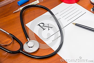 Blank medical prescription with stethoscope, pills, pen Stock Photo