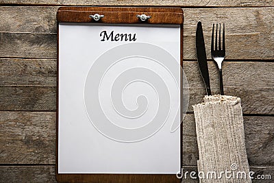 Blank menu with cutlery on wooden table Stock Photo