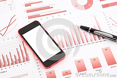 Blank mobile phone on red graphs, charts , data and business re Stock Photo