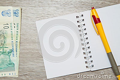 Blank notebook page and pen with South African Rand Stock Photo