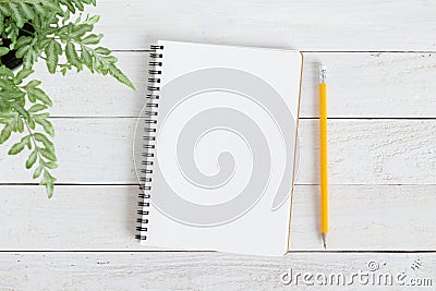 Blank notebook with and pencil on white wood,Flat lay photo of notebook for your message Stock Photo
