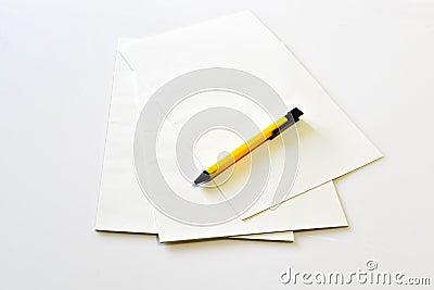 Blank notebook with yellow pen Stock Photo