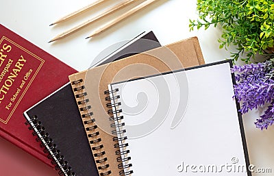 Blank notebooks, three wooden pencils and colorful tabs index Stock Photo