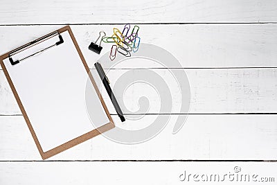 Blank notepad with fountain pen and various clips over white woo Stock Photo