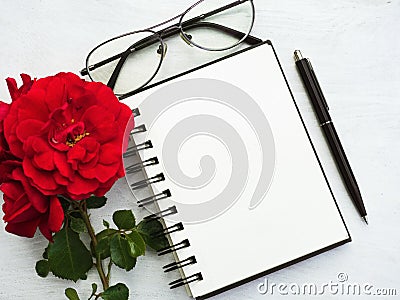 Blank notepad page and a beautiful flower Stock Photo