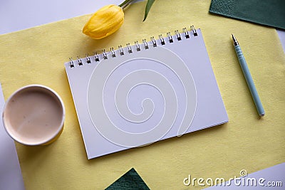 Blank notepad on yellow background Stock Photo